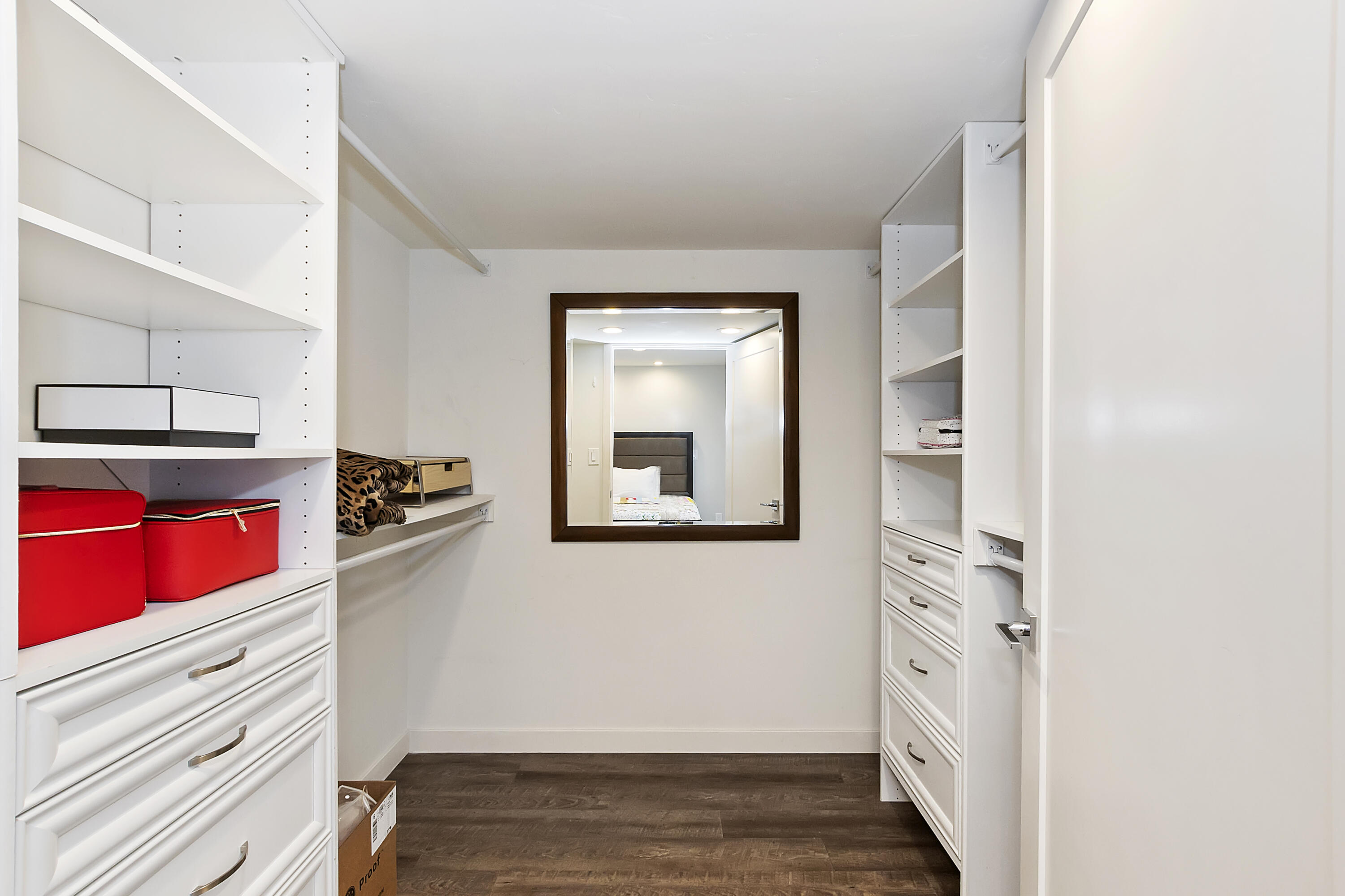 70260 Highway 111, Unit 60 Rancho Mirage, CA 92270 - Photo 11 of 15 a view of a kitchen with wooden floor and cabinets
