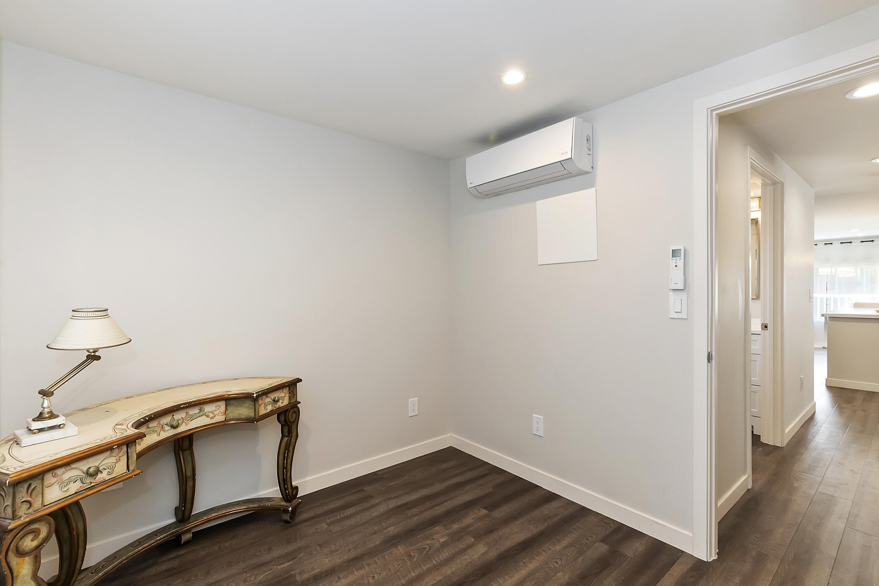 70260 Highway 111, Unit 60 Rancho Mirage, CA 92270 - Photo 12 of 15 a view of an empty room and wooden floor