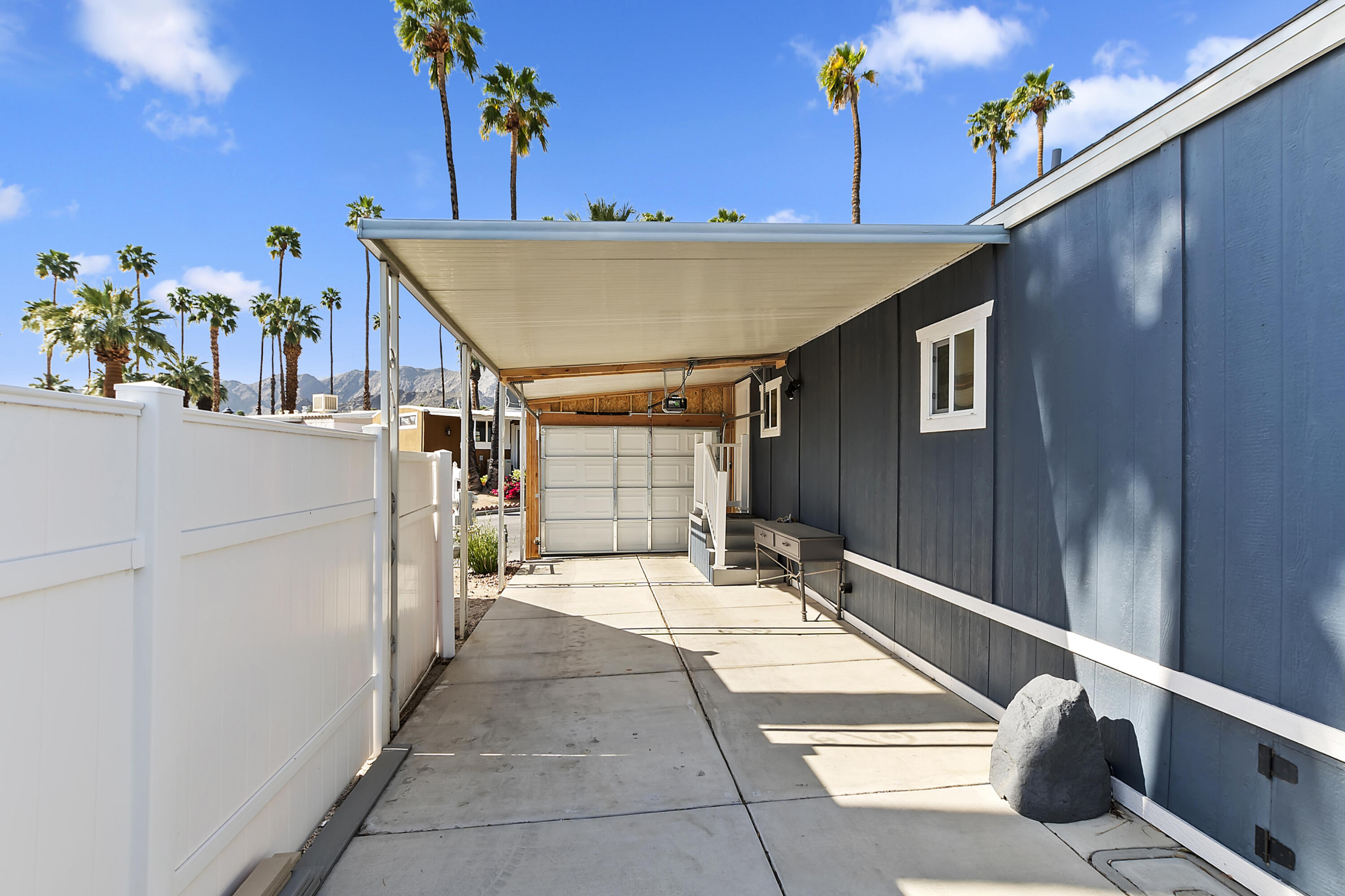 70260 Highway 111, Unit 60 Rancho Mirage, CA 92270 - Photo 15 of 15 a view of a patio with table and chairs