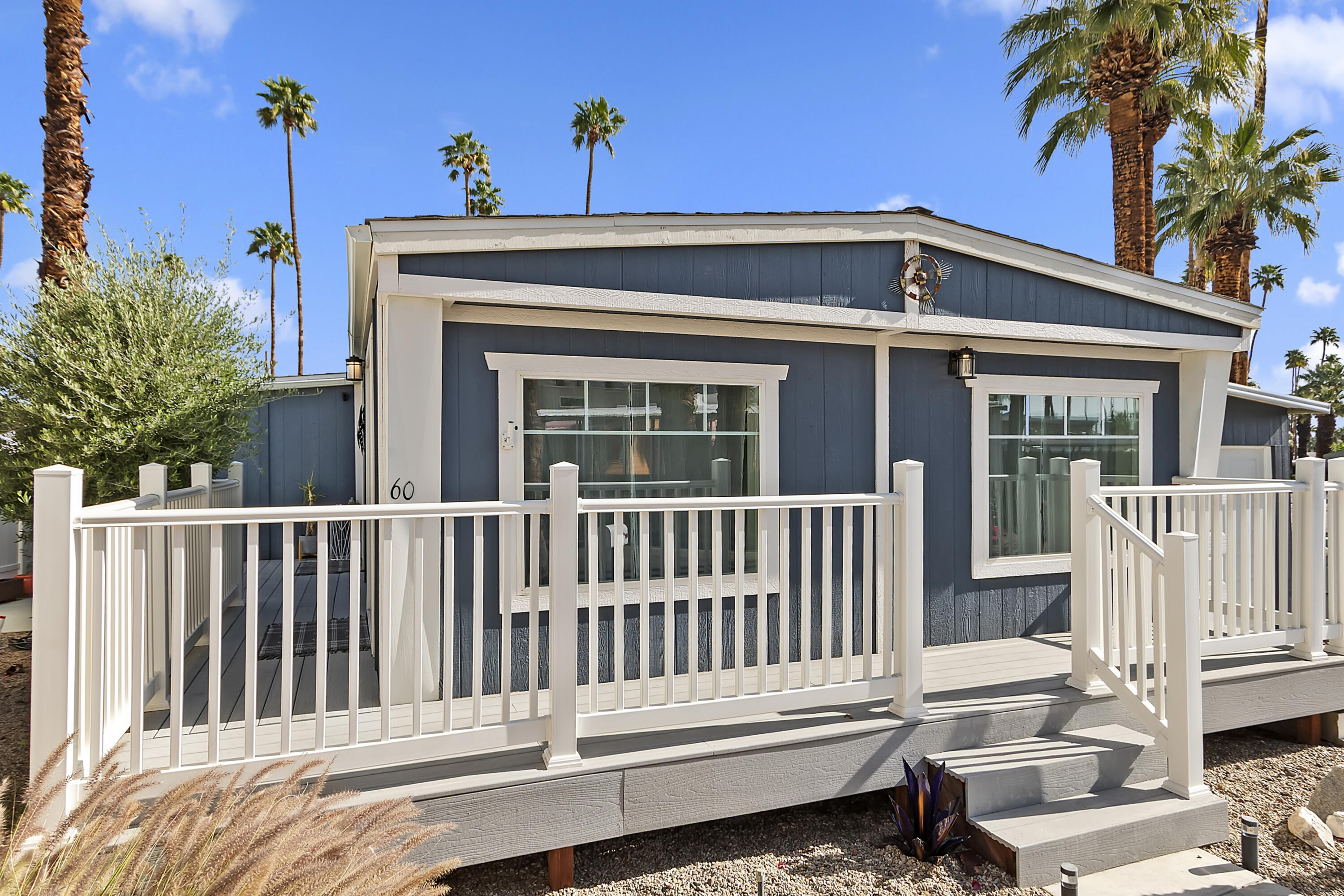70260 Highway 111, Unit 60 Rancho Mirage, CA 92270 - Photo 2 of 15 a view of a house with a small deck