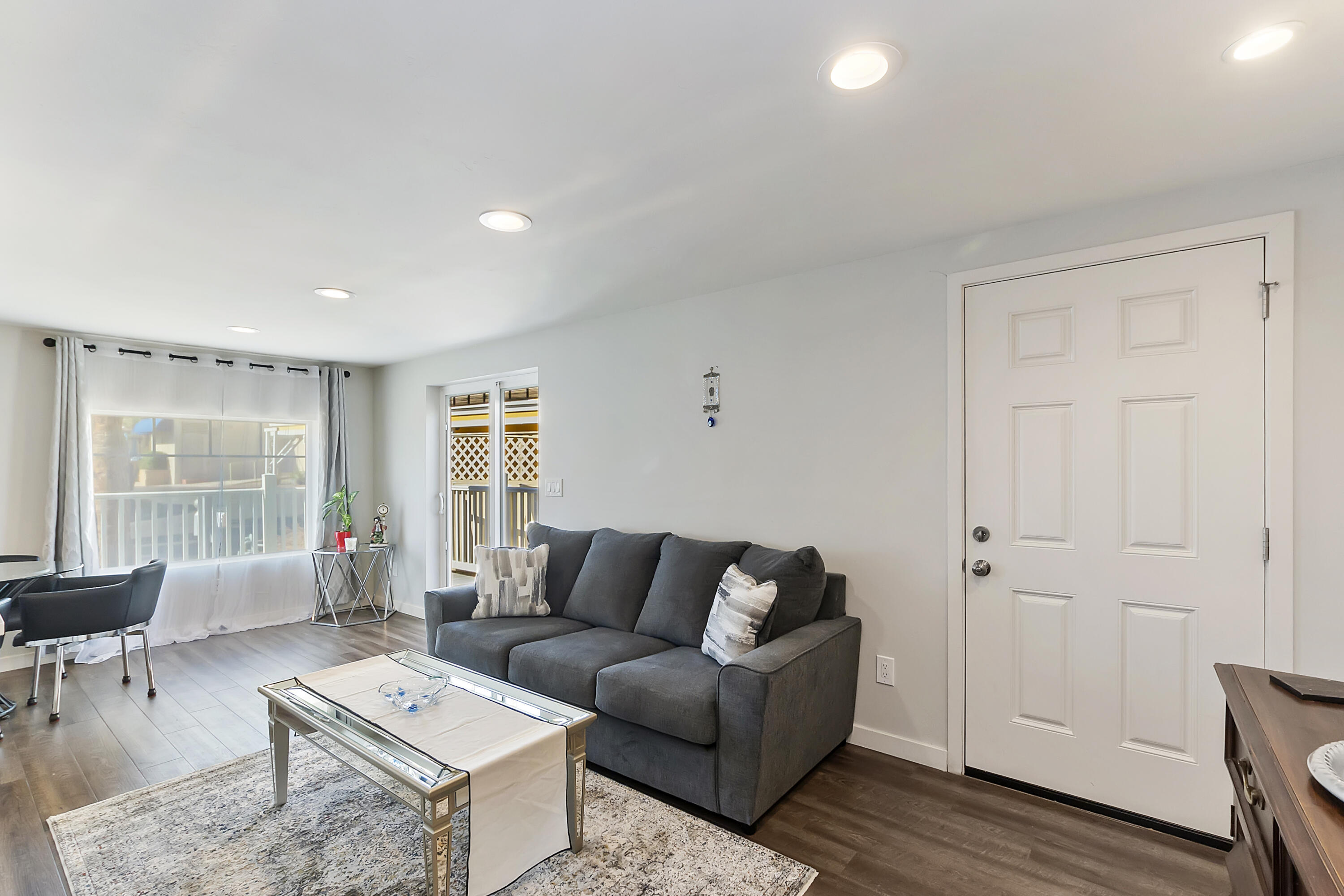 70260 Highway 111, Unit 60 Rancho Mirage, CA 92270 - Photo 5 of 15 a living room with furniture and wooden floor