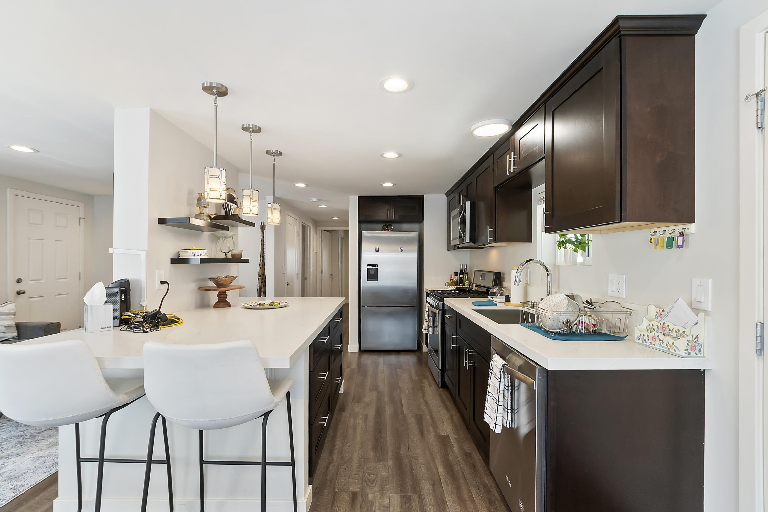 70260 Highway 111, Unit 60 Rancho Mirage, CA 92270 - Photo 7 of 15 a kitchen with stainless steel appliances a sink stove and refrigerator