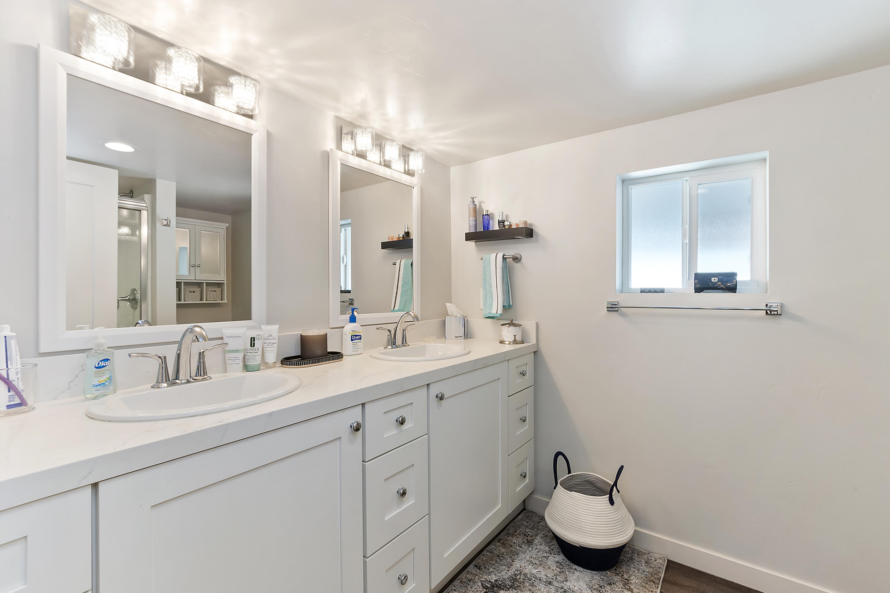 70260 Highway 111, Unit 60 Rancho Mirage, CA 92270 - Photo 10 of 15 a bathroom with a double vanity sink and a mirror