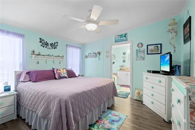 a bedroom with a bed and a dresser in it