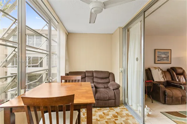 a view of a dining room with furniture window and outside view