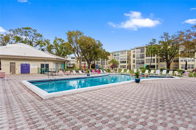 a view of houses with a street
