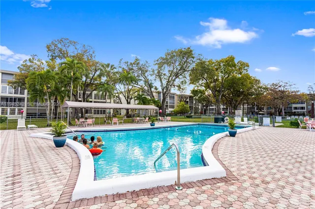 a view of a swimming pool with a patio