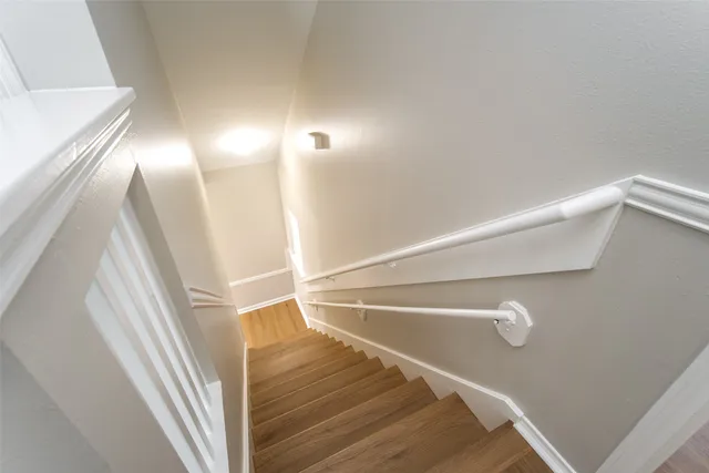 a view of staircase and hallway