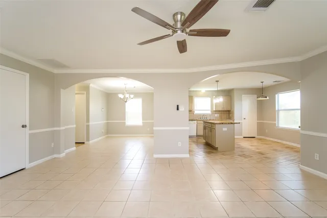 a view of a hallway with a kitchen