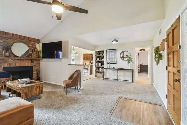 a dining room with furniture a window and a chandelier