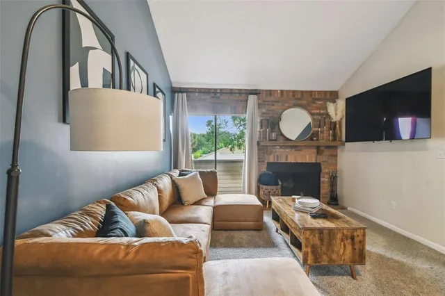 a view of kitchen with sink and microwave