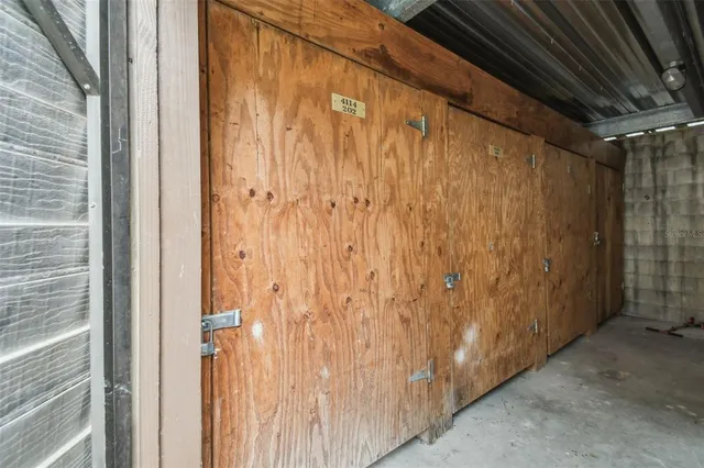 an aerial view of a house with garden space and street view