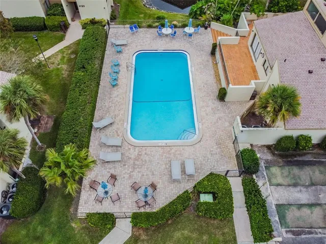 a view of a swimming pool with a lake view