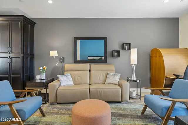 a living room with furniture and a lamp