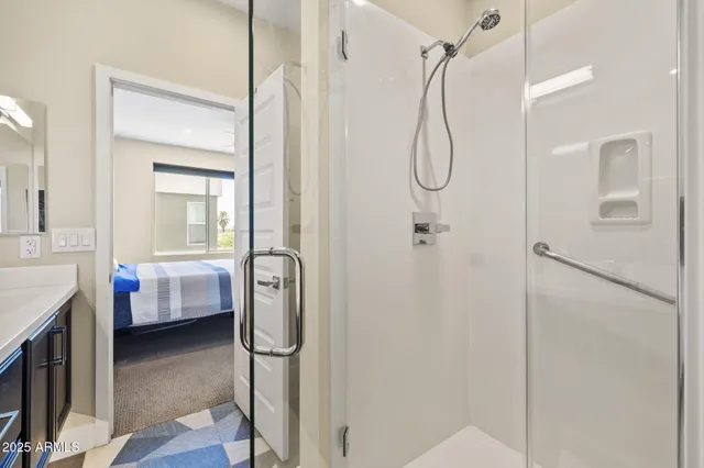 a bathroom with a glass shower door