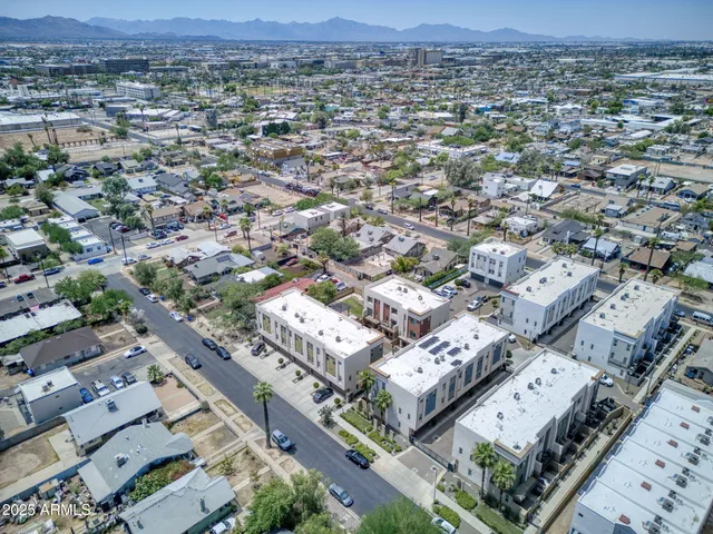 an aerial view of a city with lots of residential buildings