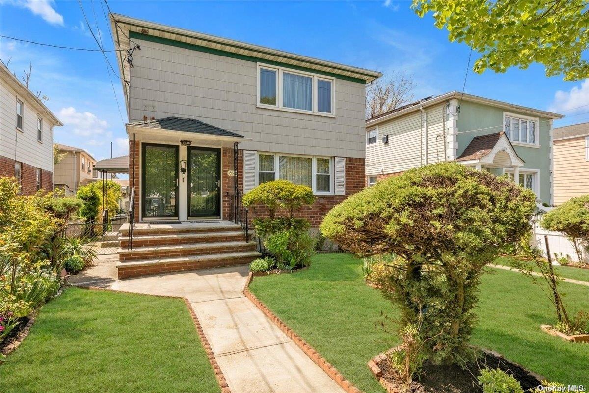 182-12 145th Road Queens, NY 11413 - Photo 1 of 1 a view of a house with a yard