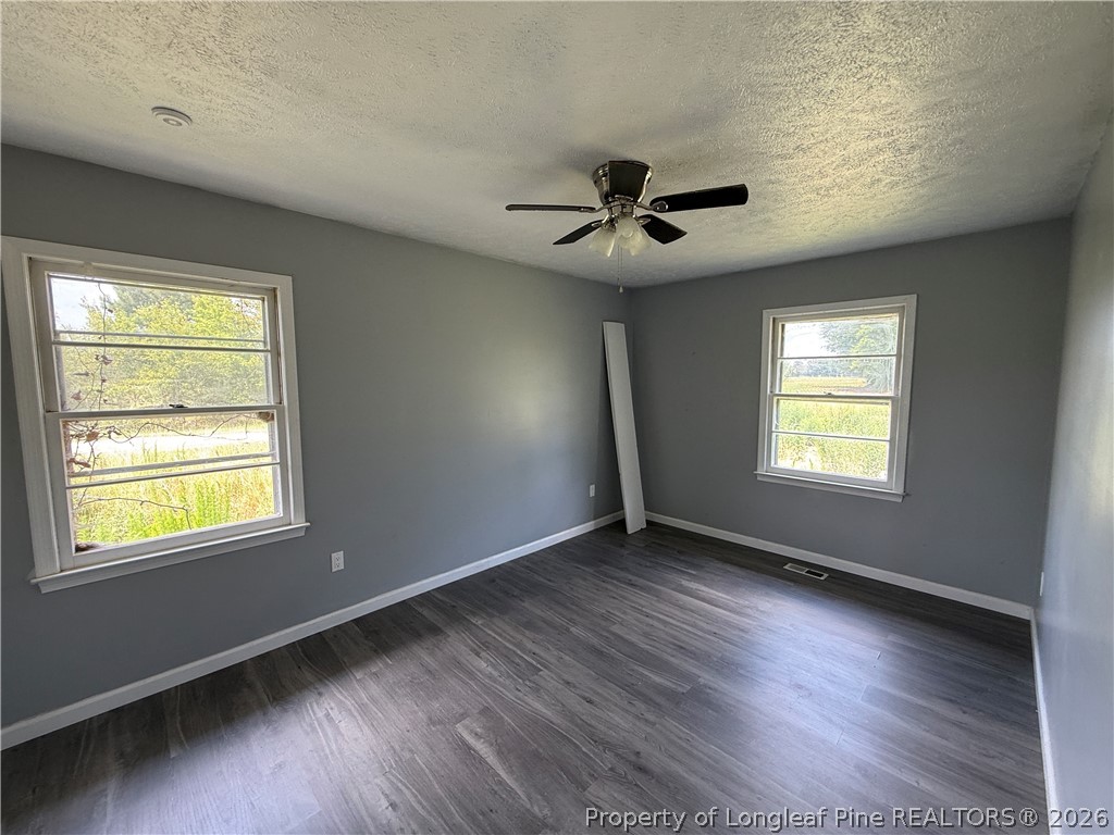 736 Tobermory Road Fayetteville, NC 28306 - Photo 9 of 17 a view of an empty room window and wooden floor