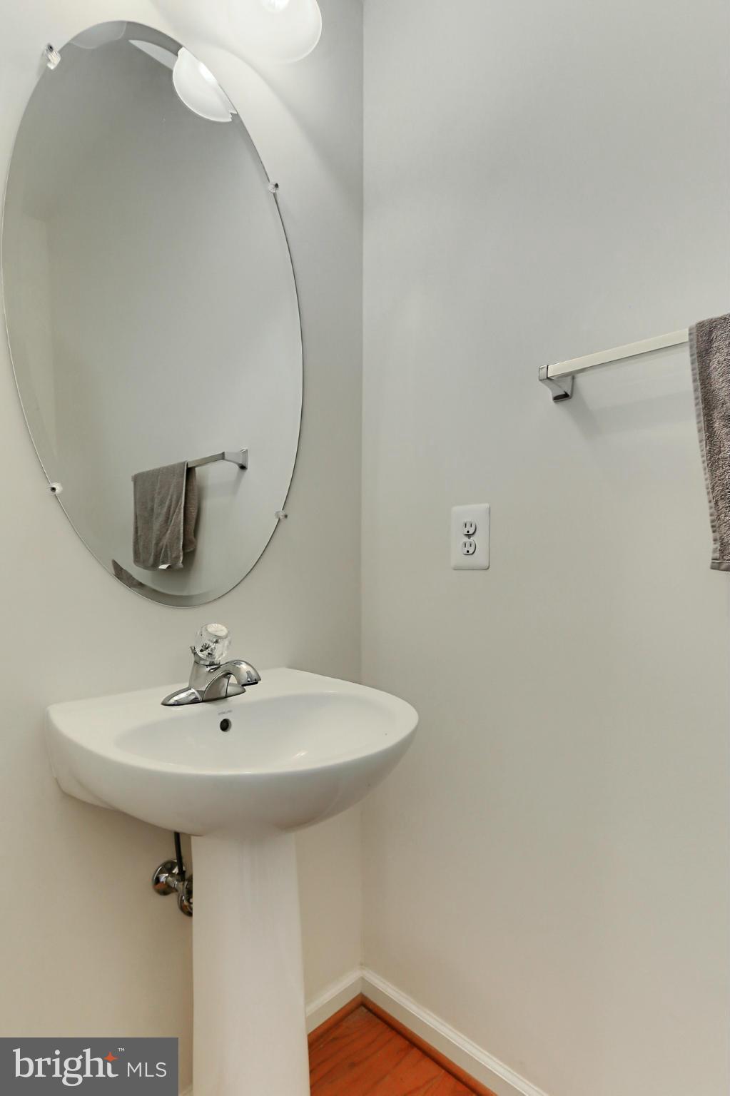 9419 Zebedee Street Manassas, VA 20110 - Photo 14 of 30 a bathroom with a sink a mirror and shower