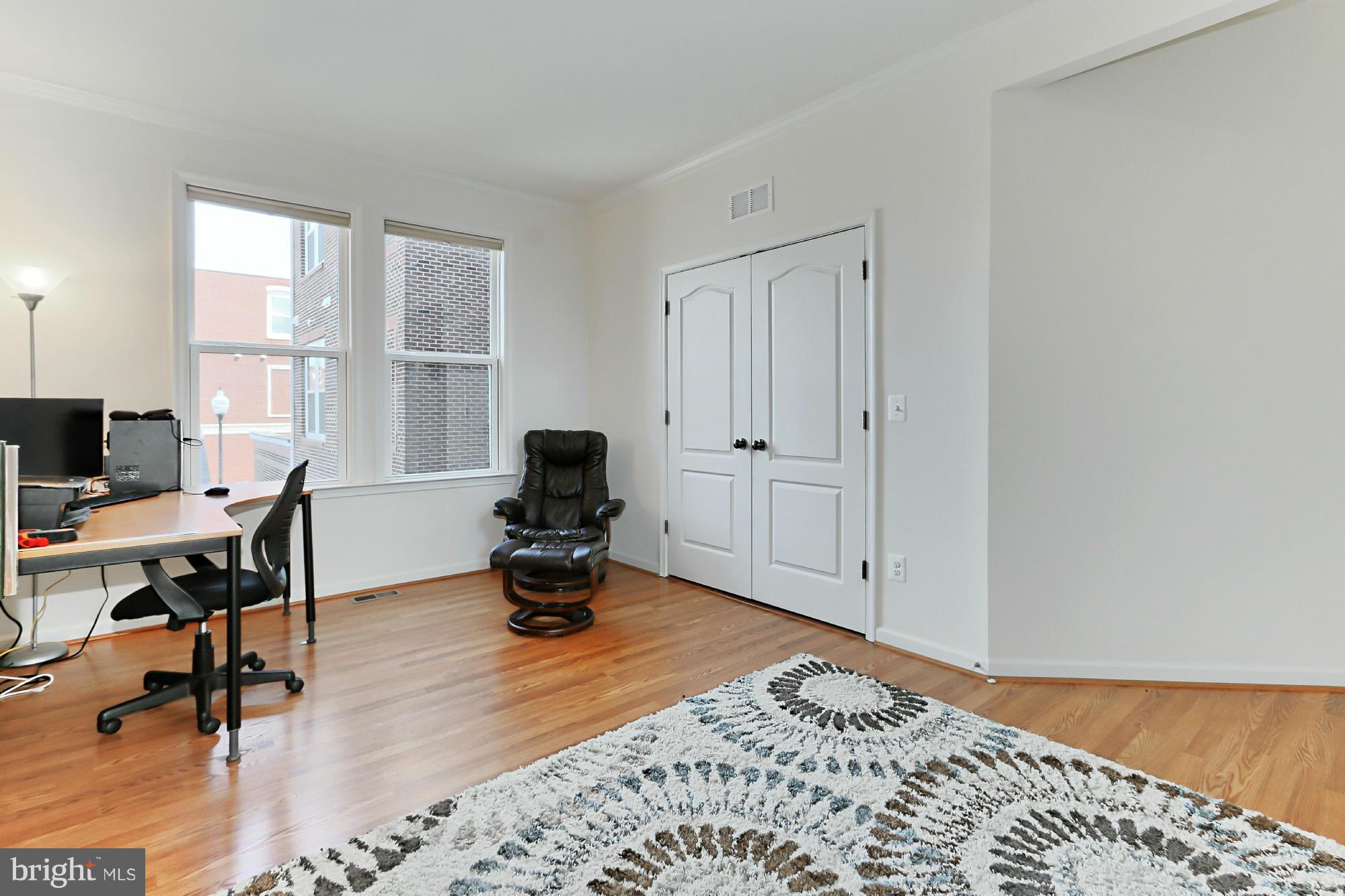 9419 Zebedee Street Manassas, VA 20110 - Photo 15 of 30 a view of a workspace with furniture and a window