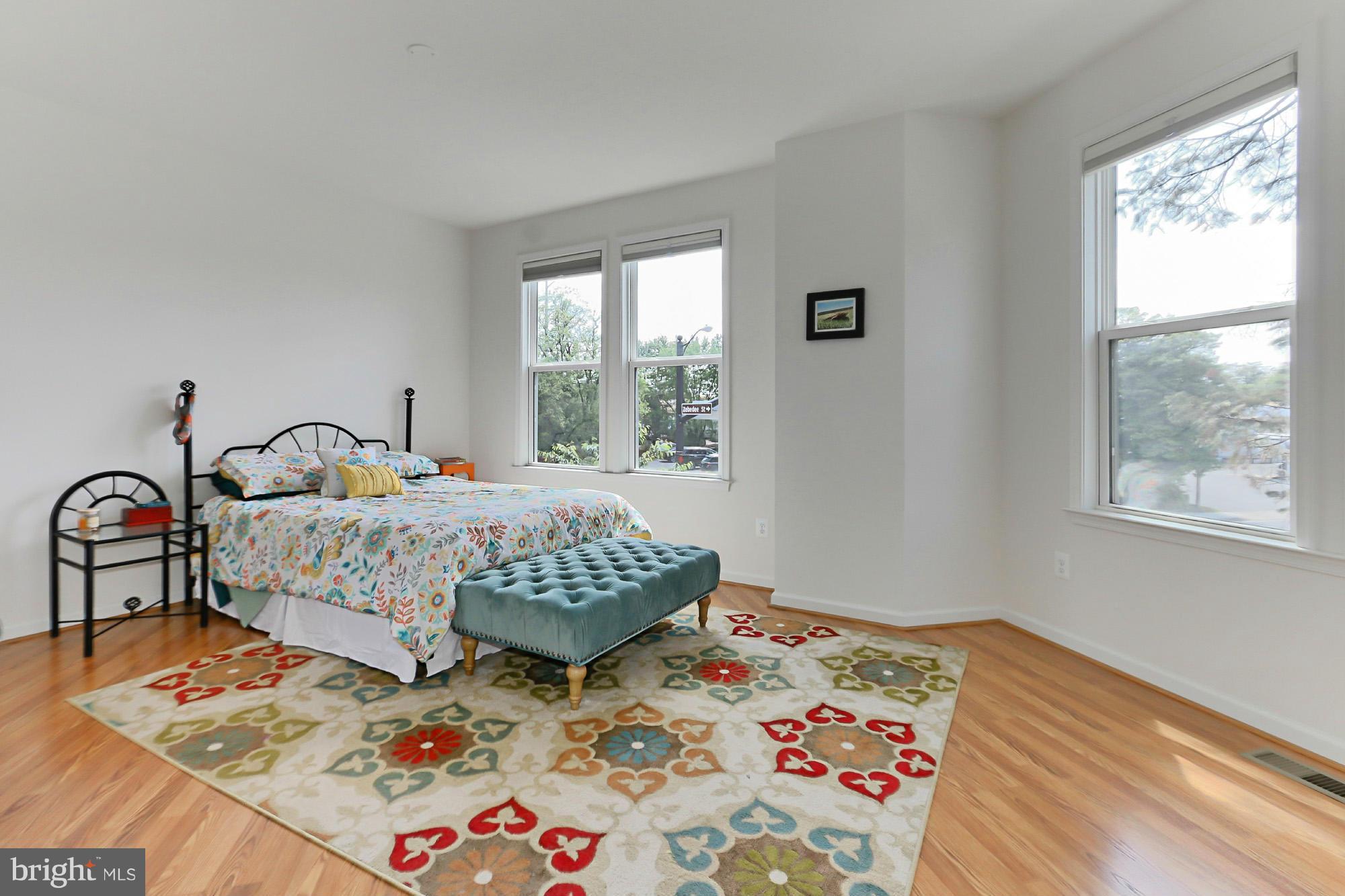 9419 Zebedee Street Manassas, VA 20110 - Photo 18 of 30 a bedroom with a bed and a window