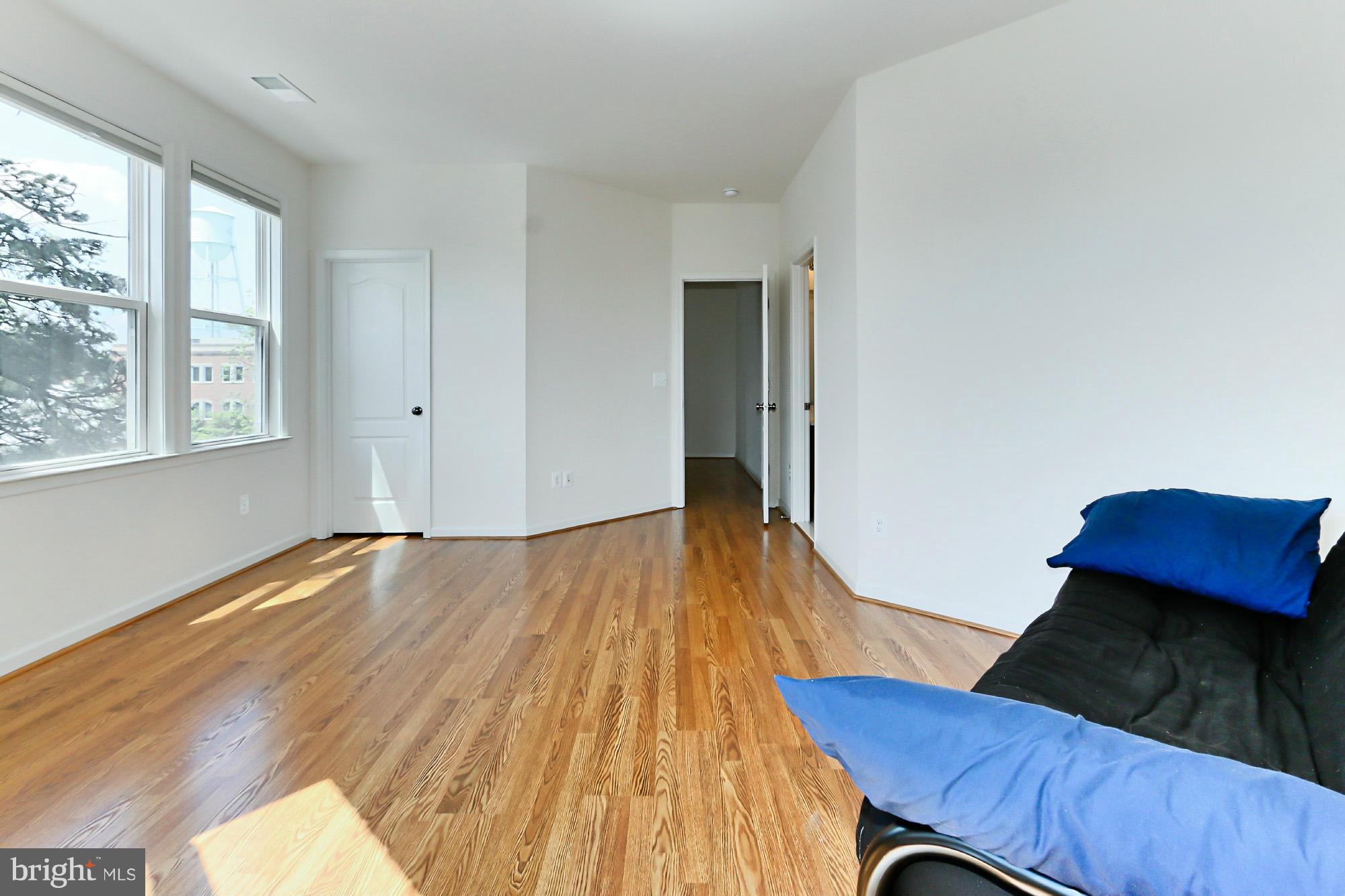 9419 Zebedee Street Manassas, VA 20110 - Photo 22 of 30 a view of room with hardwood floor and a window