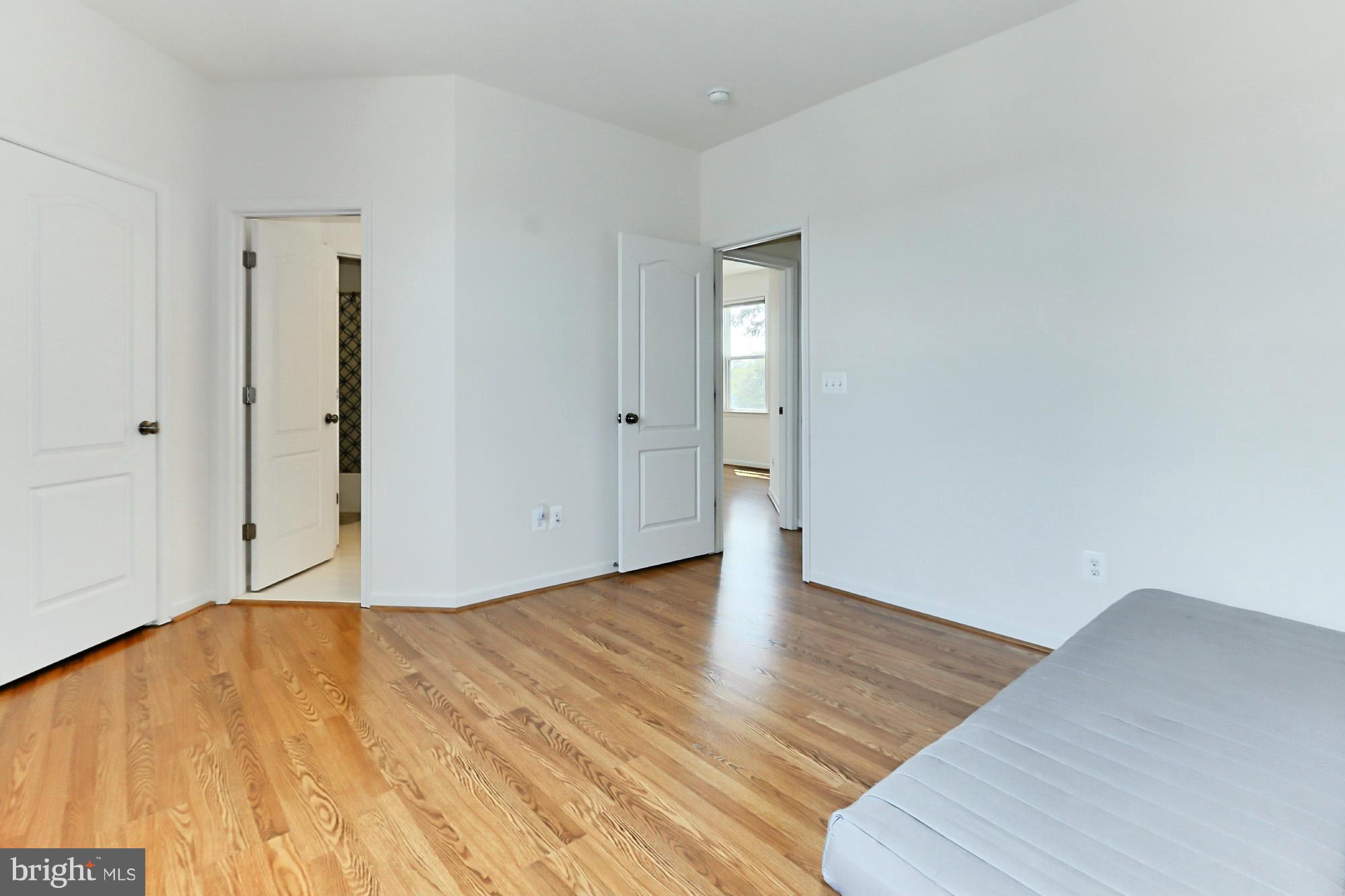 9419 Zebedee Street Manassas, VA 20110 - Photo 24 of 30 a view of an empty room with wooden floor and closet