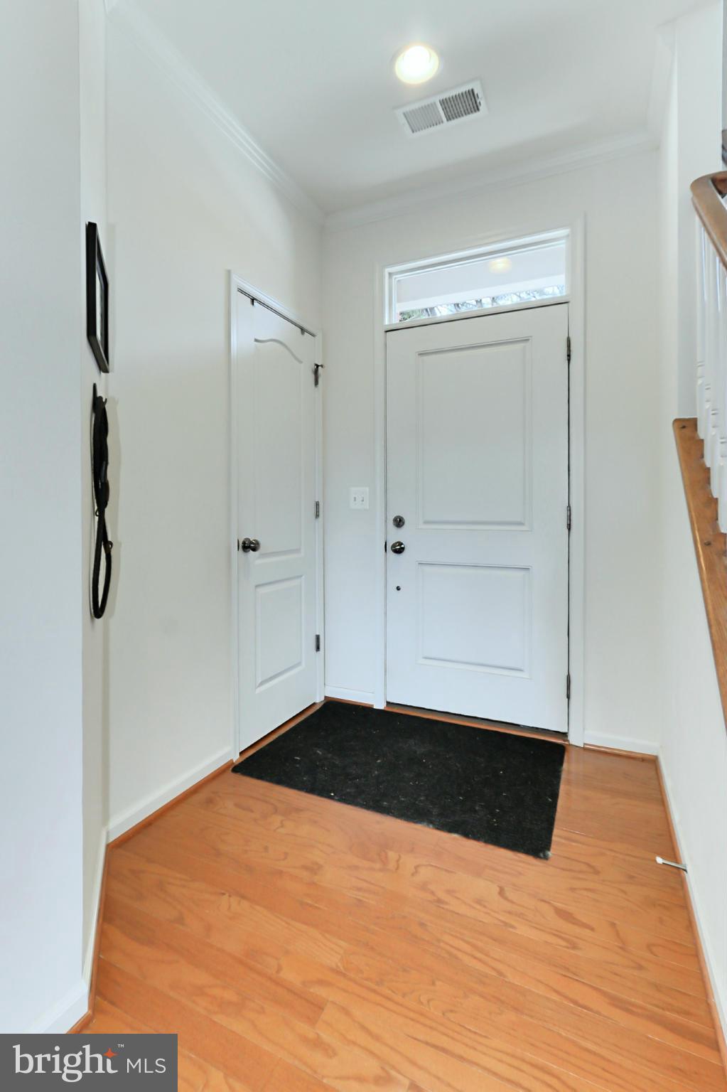 9419 Zebedee Street Manassas, VA 20110 - Photo 4 of 30 a view of empty room with wooden floor
