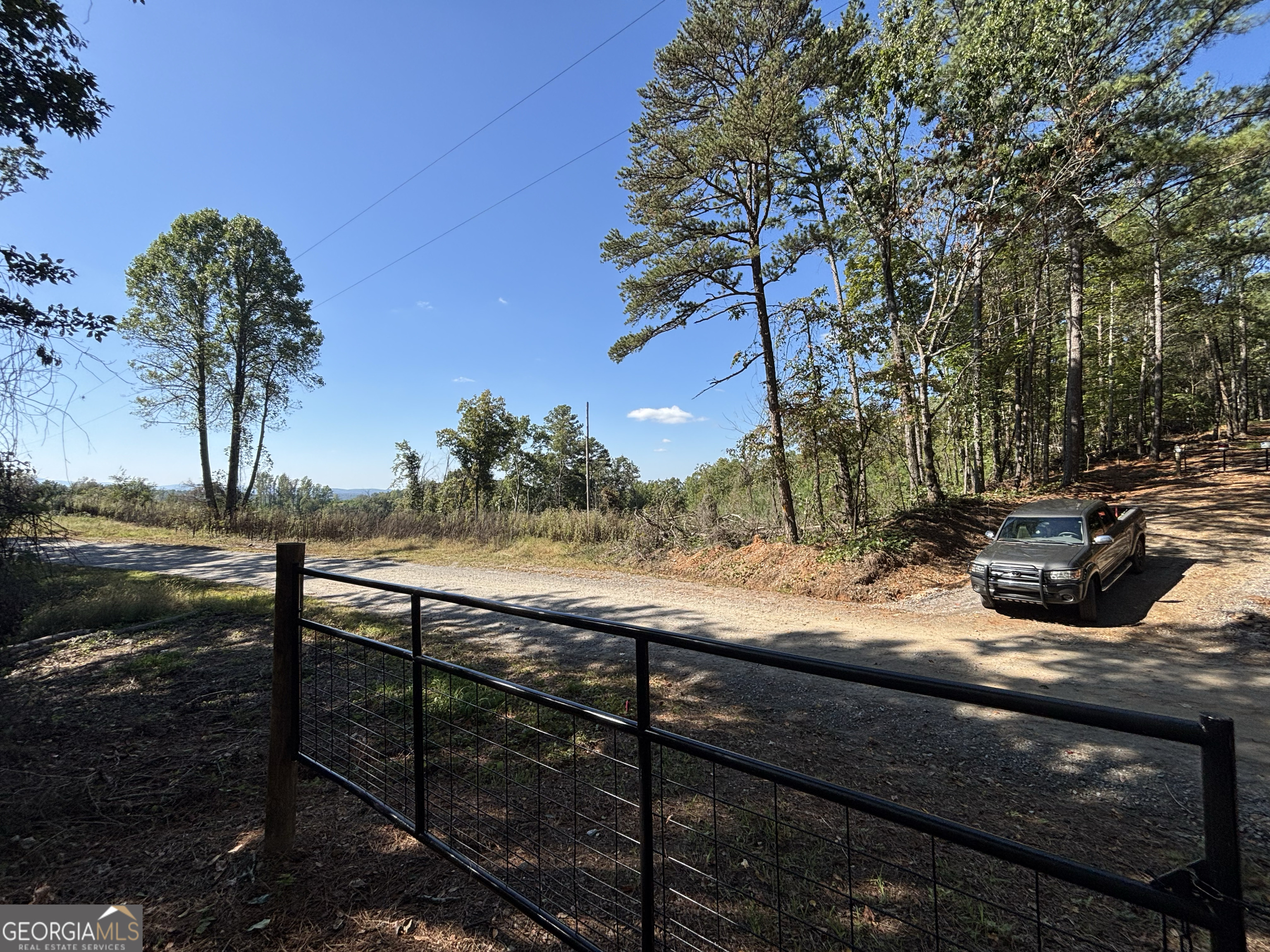 6-west Dry Pond Road, Unit LOT #6 WEST Ranger, GA 30734 - Photo 2 of 19 a view of a yard and car parked from a park