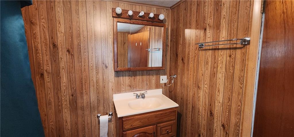 499 Filbert Orient Road Fairbank, PA 15435 - Photo 22 of 23 a bathroom with a sink and a mirror