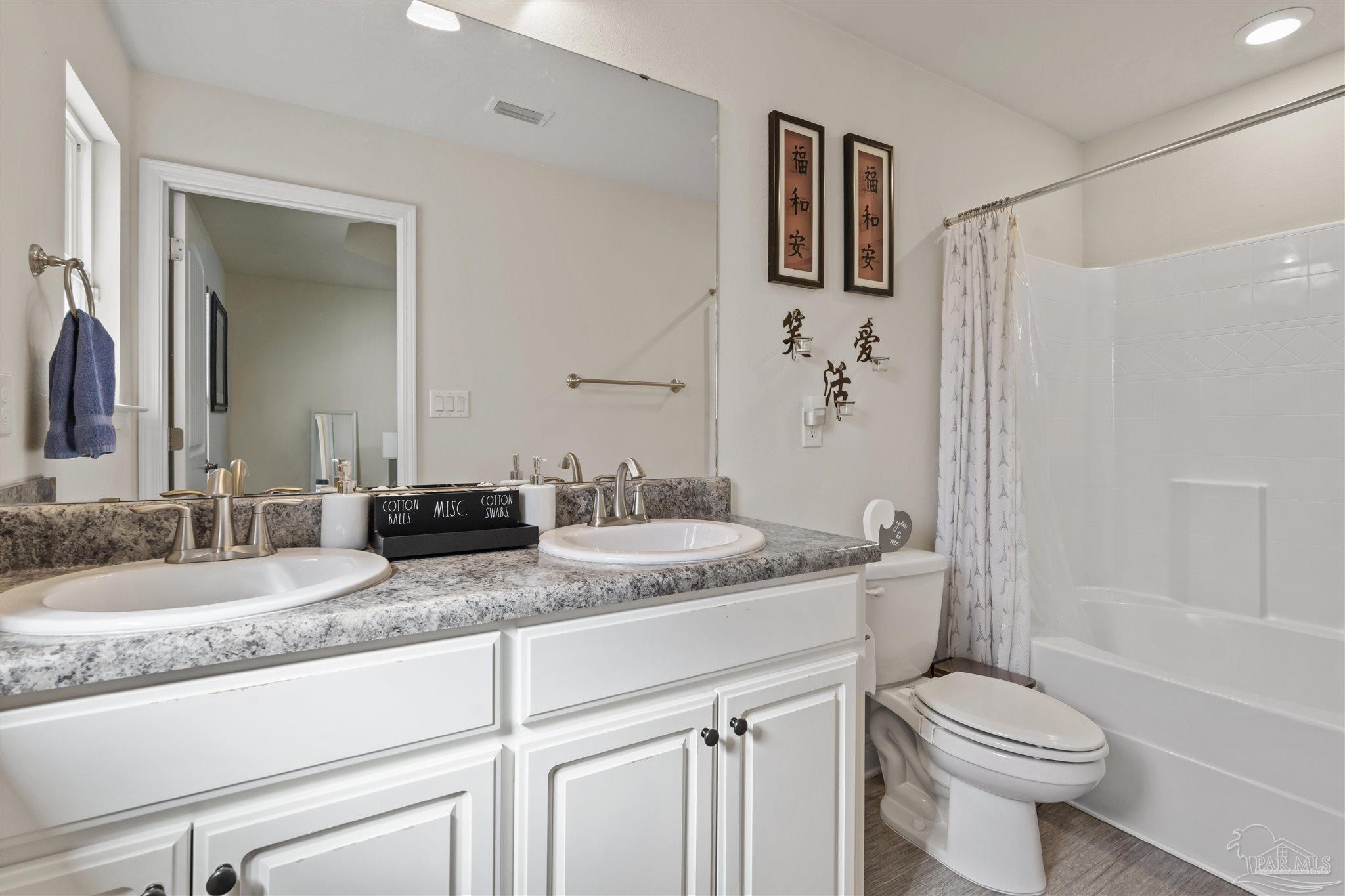 151 Cottage View Drive Pensacola, FL 32507 - Photo 12 of 17 a bathroom with a granite countertop sink toilet and shower