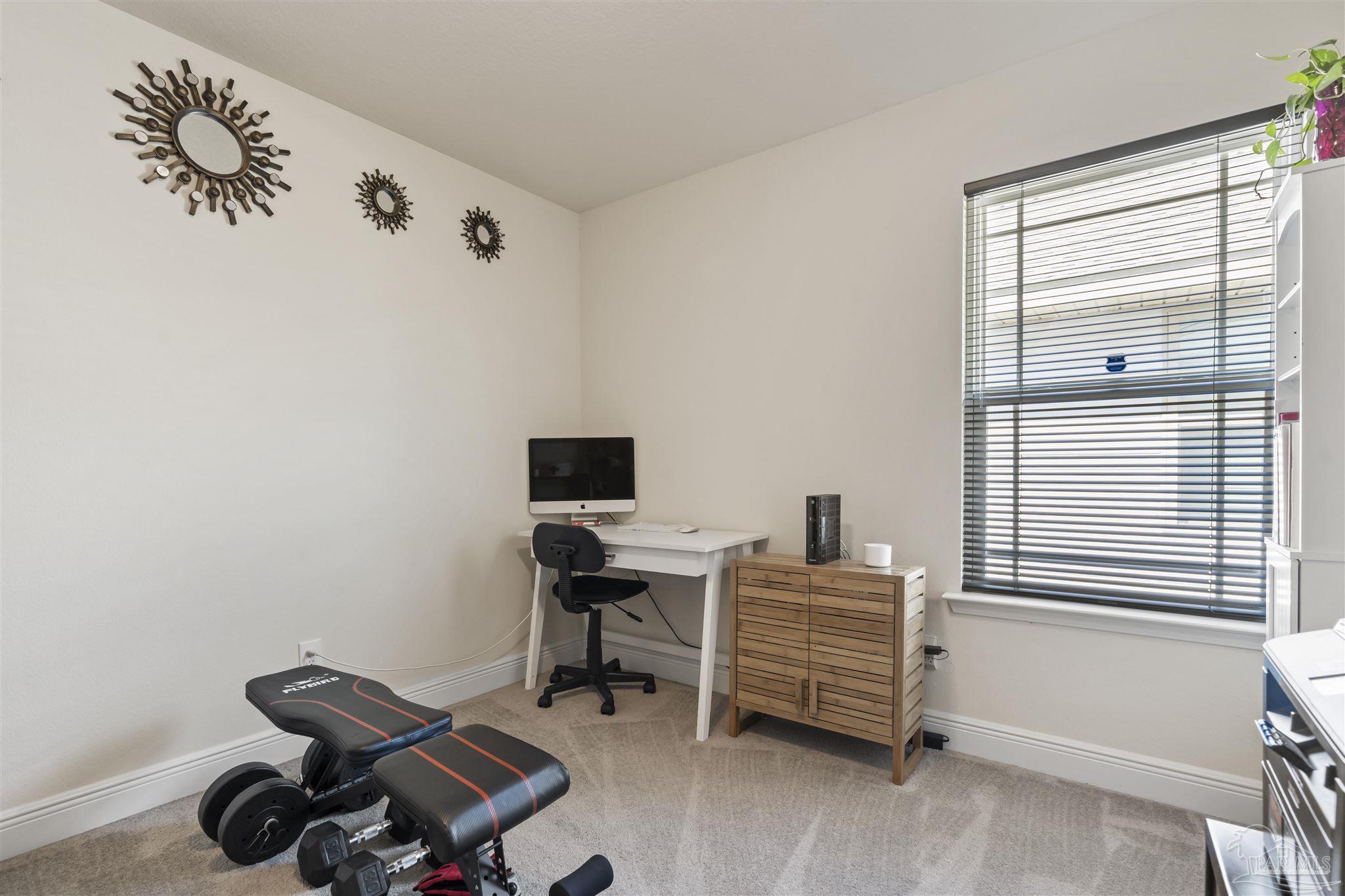 151 Cottage View Drive Pensacola, FL 32507 - Photo 15 of 17 a view of a workspace with furniture and a window