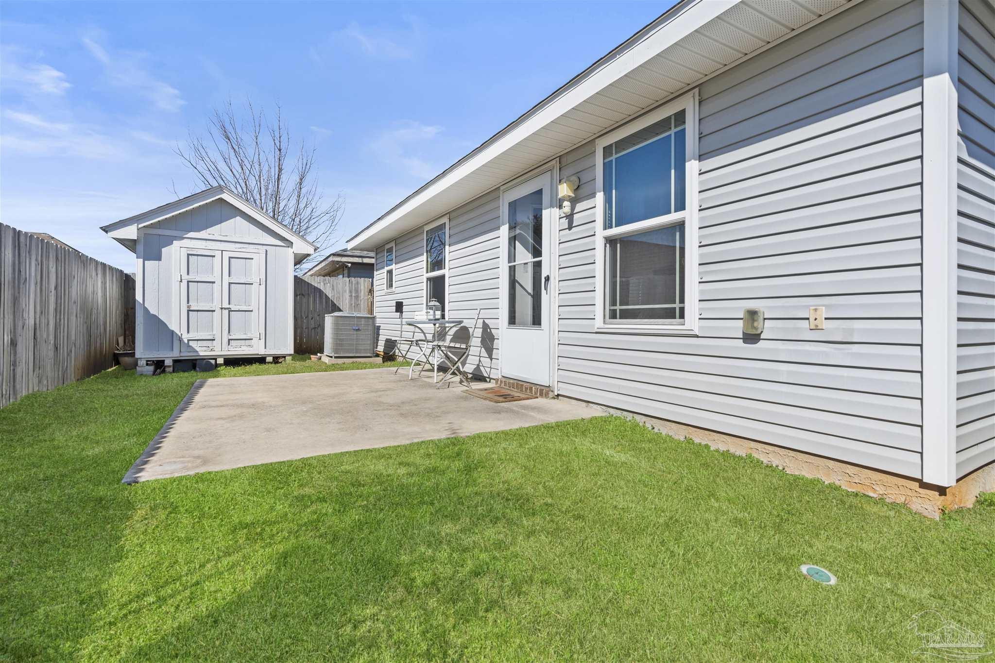 151 Cottage View Drive Pensacola, FL 32507 - Photo 17 of 17 a front view of a house with a yard and garage