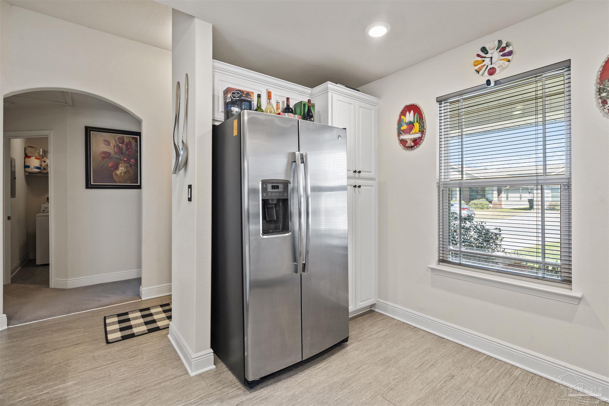 151 Cottage View Drive Pensacola, FL 32507 - Photo 5 of 17 a kitchen with stainless steel appliances granite countertop a refrigerator and a window