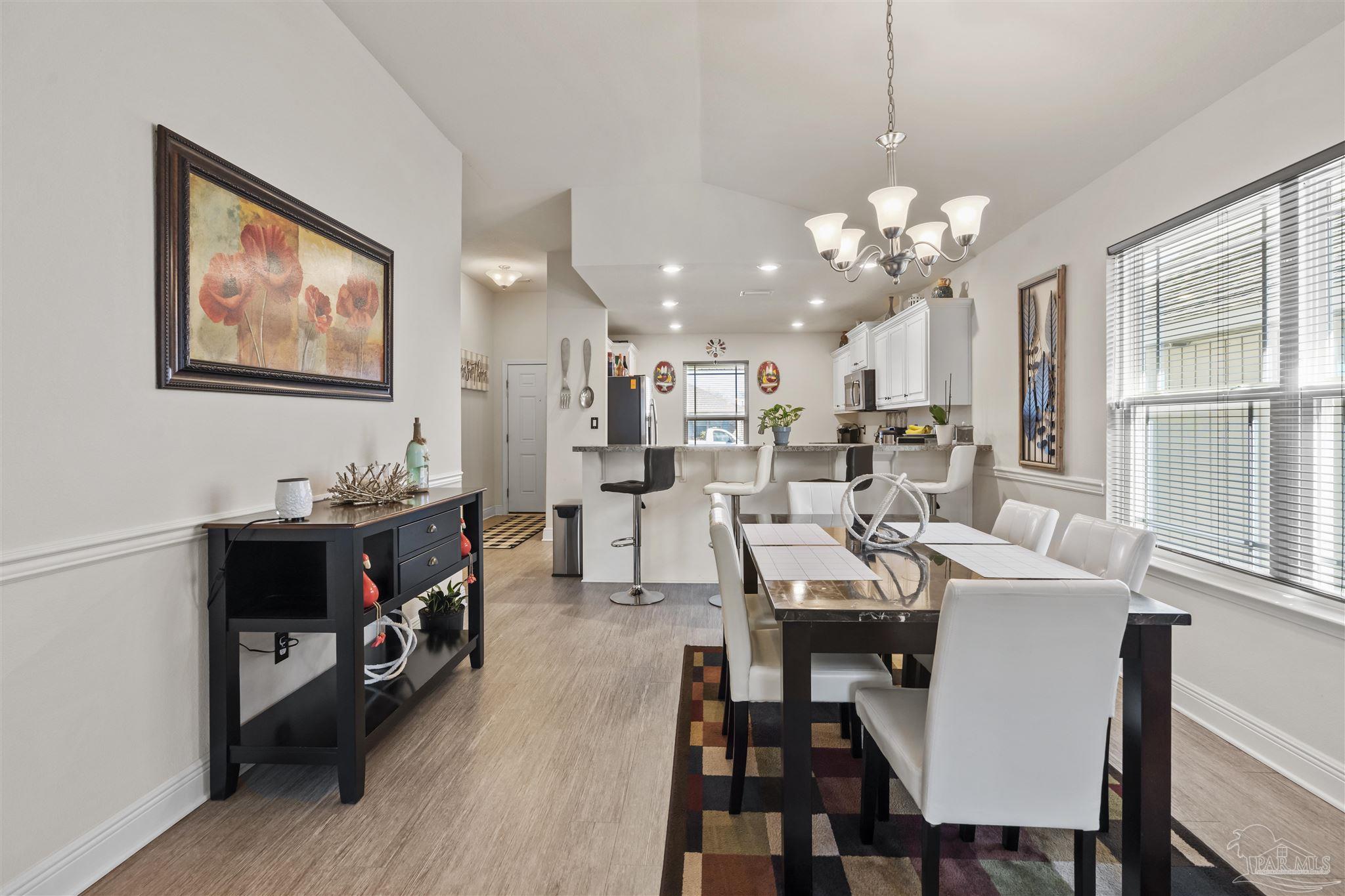151 Cottage View Drive Pensacola, FL 32507 - Photo 6 of 17 a view of a dining room with furniture window and wooden floor