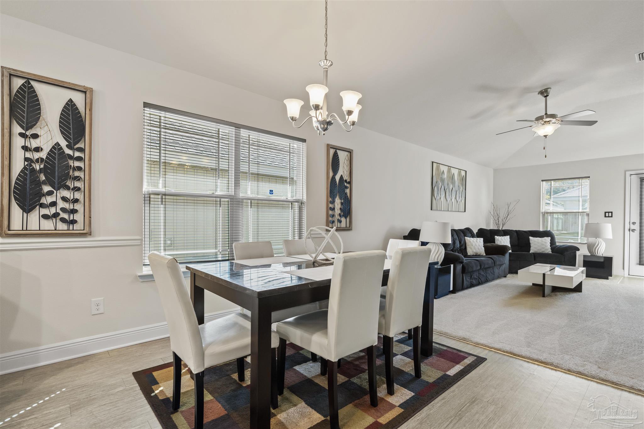 151 Cottage View Drive Pensacola, FL 32507 - Photo 7 of 17 a view of a dining room with furniture and a chandelier
