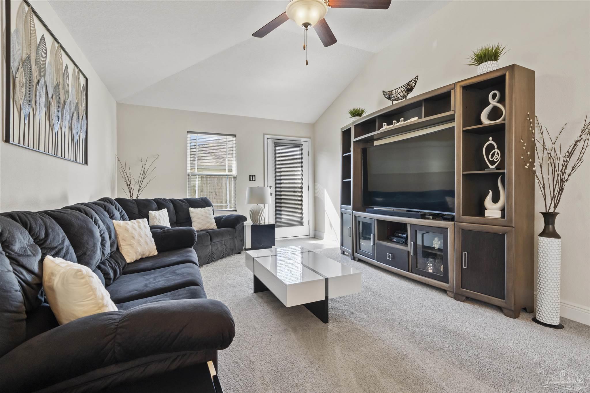151 Cottage View Drive Pensacola, FL 32507 - Photo 9 of 17 a living room with furniture and a flat screen tv