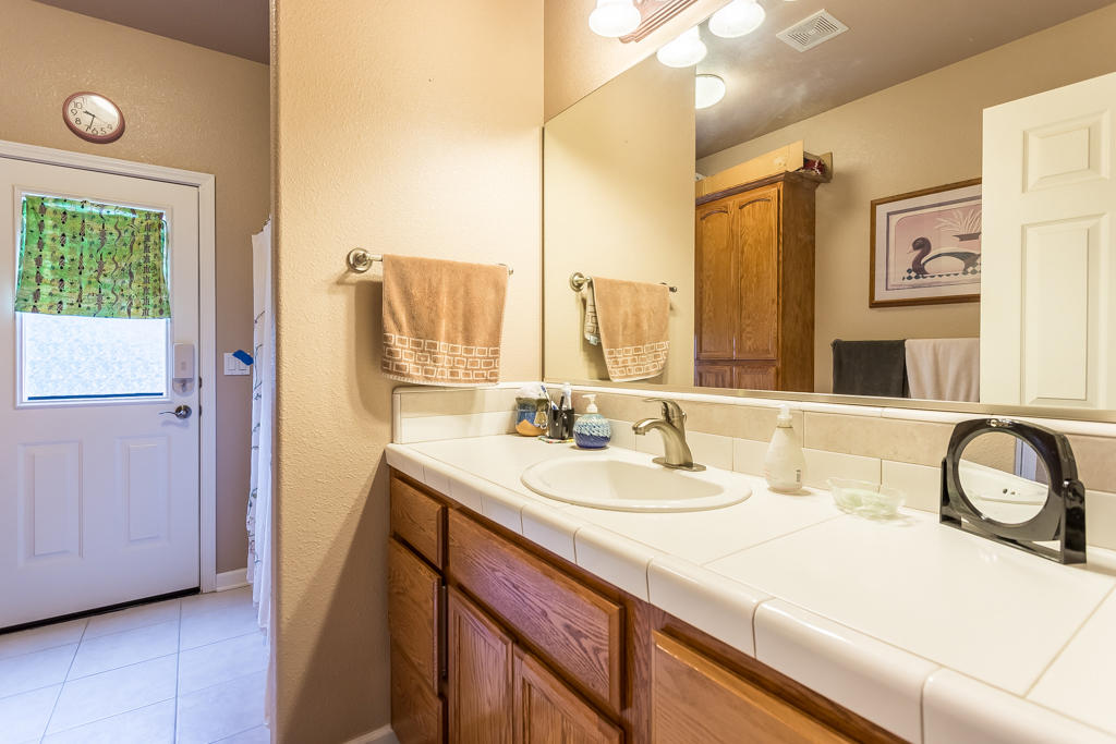 1575 Barbara Road Redding, CA 96003 - Photo 20 of 27 a bathroom with a sink and a mirror