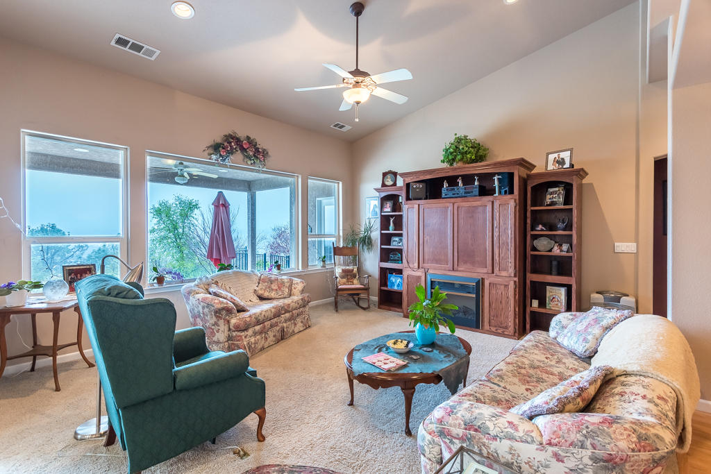 1575 Barbara Road Redding, CA 96003 - Photo 4 of 27 a living room with furniture and a large window