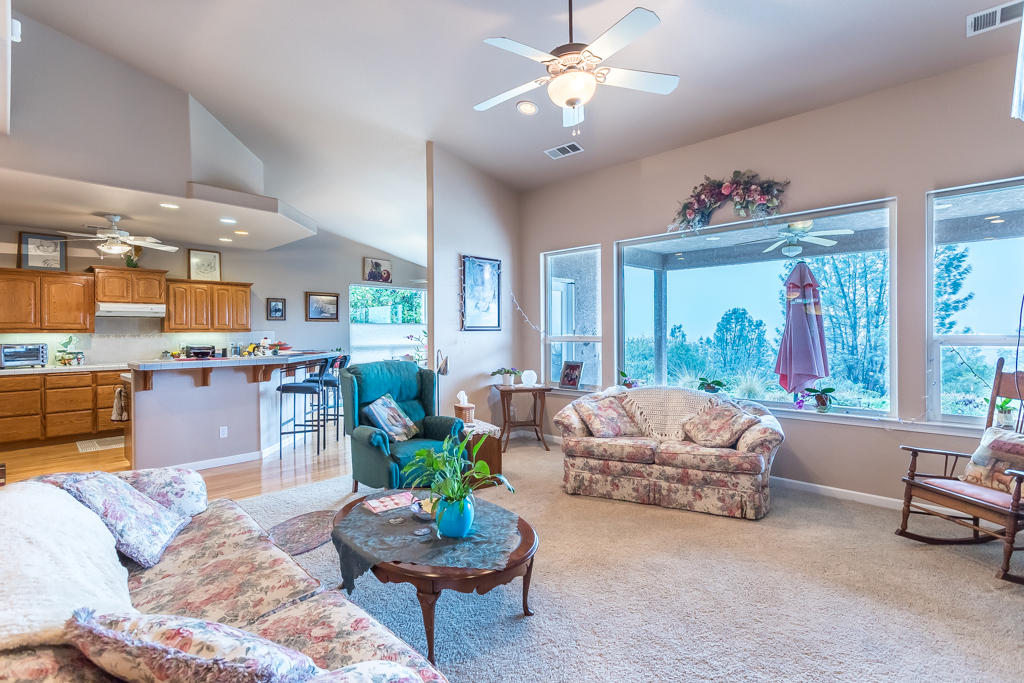 1575 Barbara Road Redding, CA 96003 - Photo 5 of 27 a living room with furniture and a large window