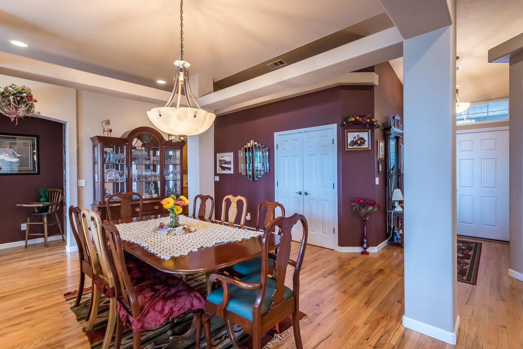 1575 Barbara Road Redding, CA 96003 - Photo 9 of 27 a view of a dining room with furniture window and wooden floor