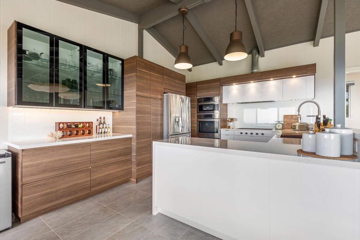 82-1019 KOA Road Captain Cook, HI 96704 - Photo 1 of 23 a view of kitchen with stainless steel appliances kitchen island large window and wooden floor