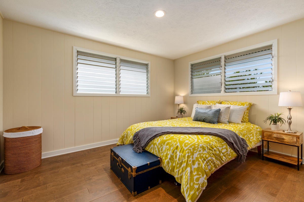 82-1019 KOA Road Captain Cook, HI 96704 - Photo 15 of 23 a bed sitting in a bedroom next to a window