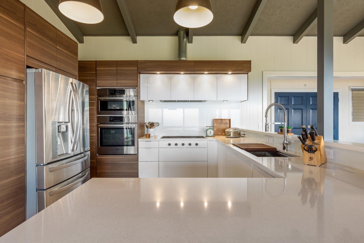 82-1019 KOA Road Captain Cook, HI 96704 - Photo 2 of 23 a kitchen with stainless steel appliances granite countertop a sink and a refrigerator
