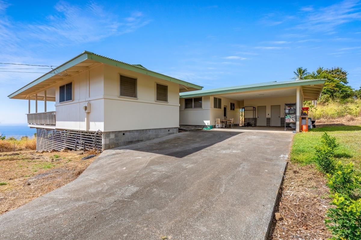 82-1019 KOA Road Captain Cook, HI 96704 - Photo 23 of 23 a front view of a house with a yard