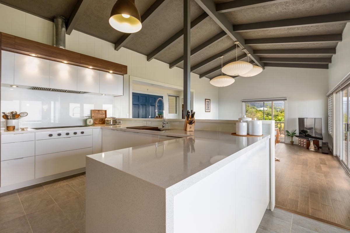 82-1019 KOA Road Captain Cook, HI 96704 - Photo 3 of 23 a large kitchen with stainless steel appliances granite countertop a sink counter space cabinets and a counter top space