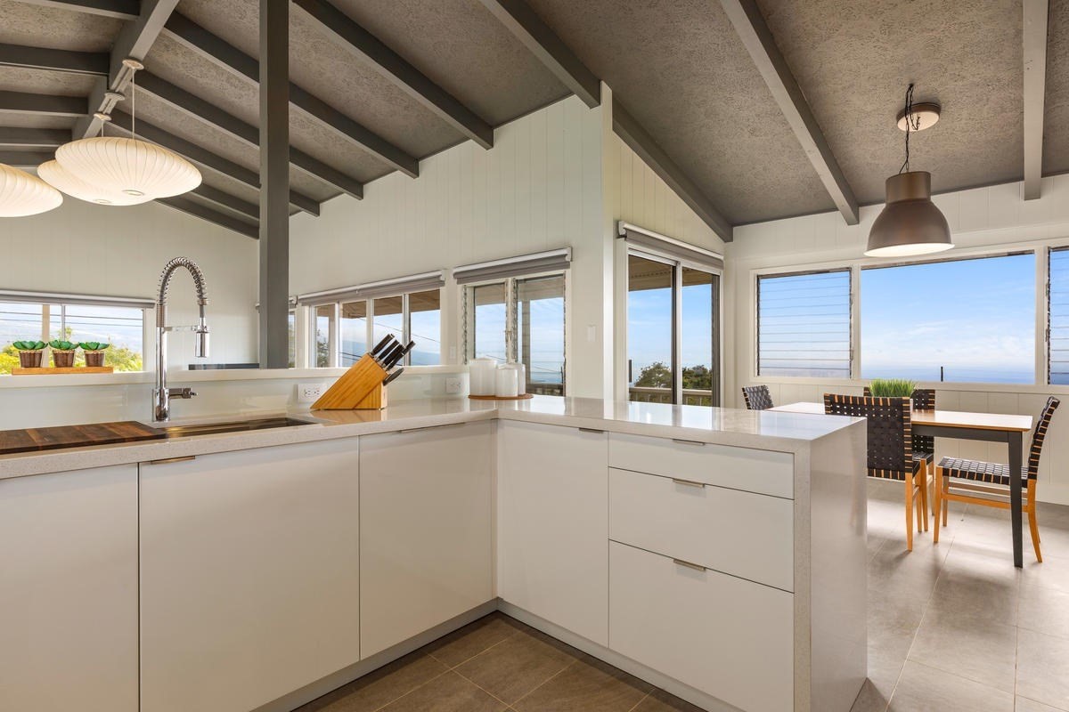 82-1019 KOA Road Captain Cook, HI 96704 - Photo 4 of 23 a kitchen with sink and chairs
