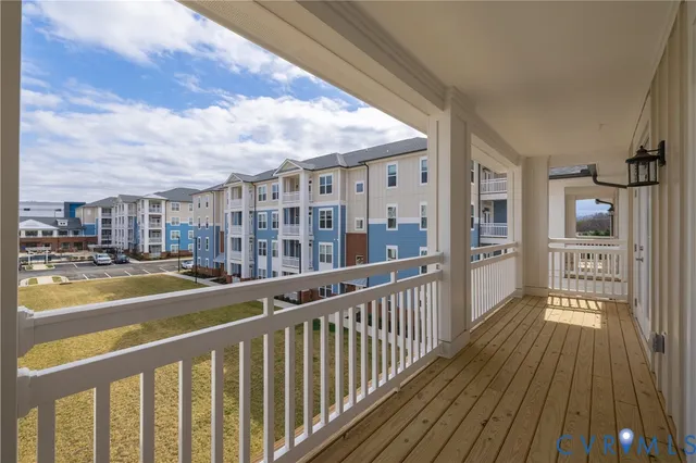 a view of a balcony with wooden floor
