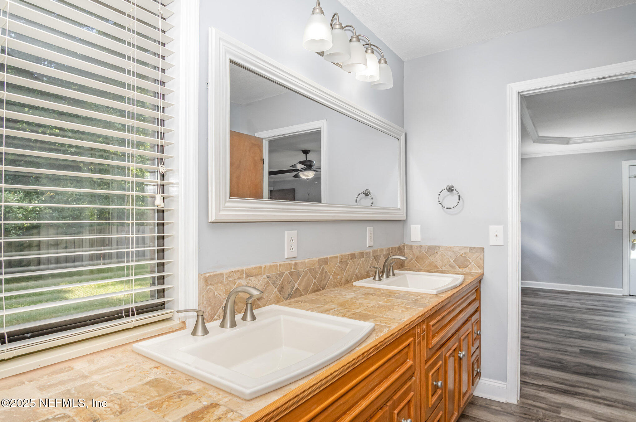 12046 Acornshell Way Jacksonville, FL 32223 - Photo 16 of 28 a bathroom with a sink and a mirror