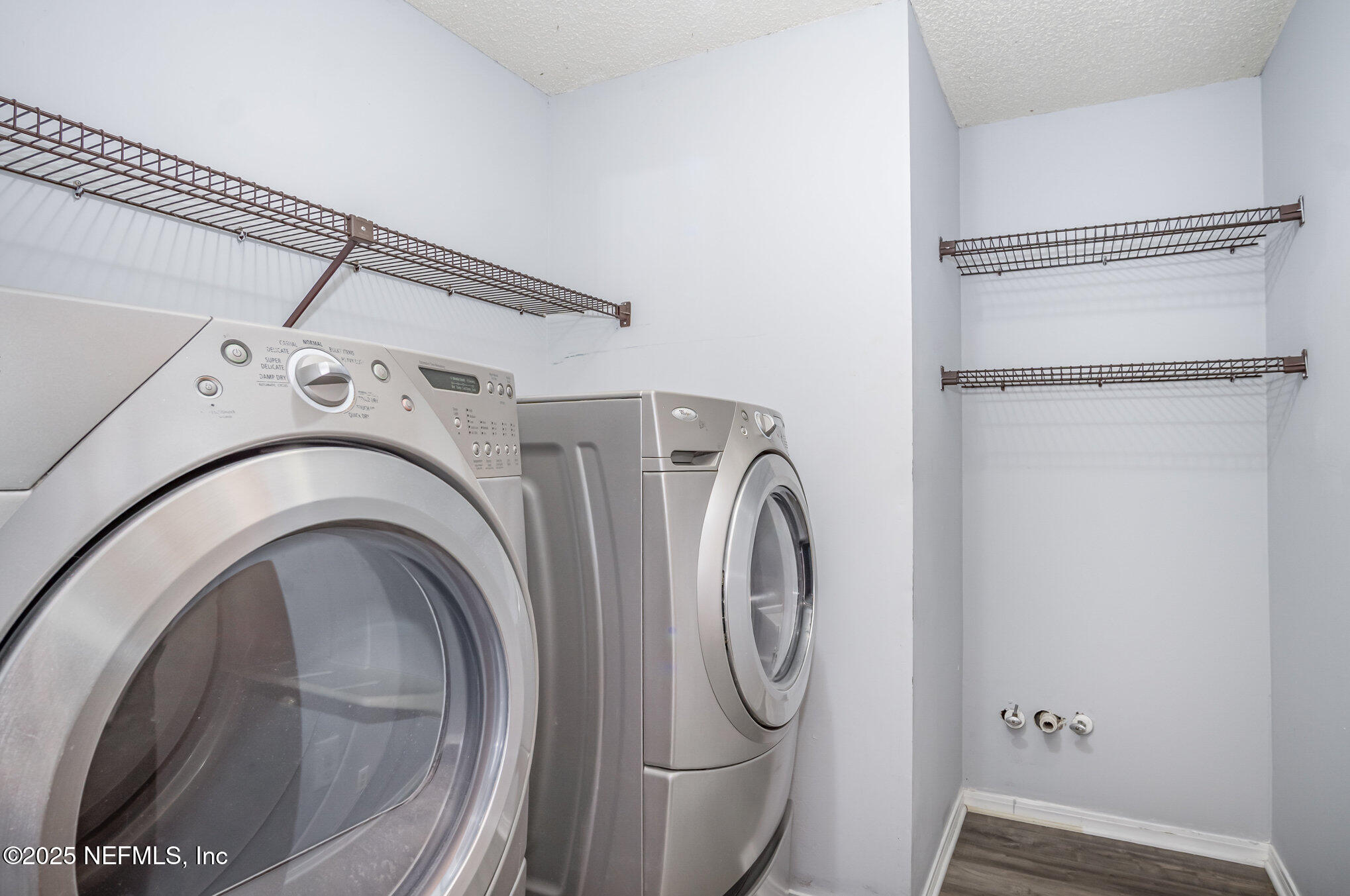12046 Acornshell Way Jacksonville, FL 32223 - Photo 23 of 28 a utility room with dryer and washer